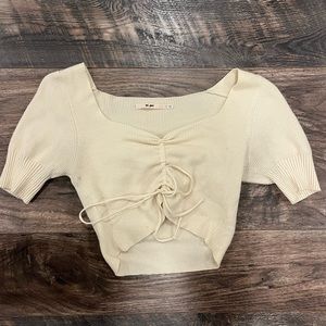 Trendy pale yellow Francesca’s top! That sinches and ties at the bottom.